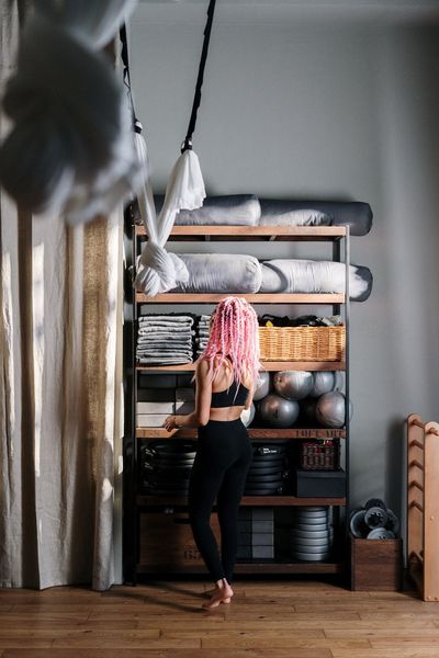 Professional yoga instructor Sofia Kravchuk smiling in studio environment